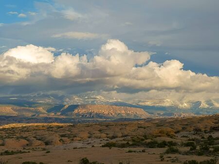 a cloud covered la sal mountains in utah