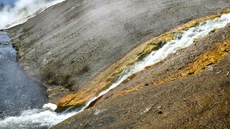 close up of hot water entering the firehole river in yellowstoneの写真素材