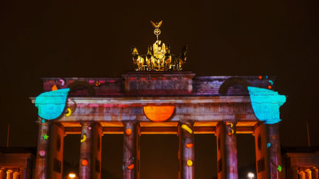 BERLIN, GERMANY OCTOBER, 7, 2017: a night shot of brandenburg gate with artworks projected onto it in berlinのeditorial素材