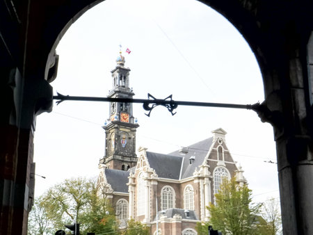 AMSTERDAM, NETHERLANDS-OCTOBER, 12, 2017: close up of westerkerk church framed by an archway in amsterdamのeditorial素材