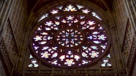 close up of the stained glass window in st vitus cathedral in prague castleの写真素材