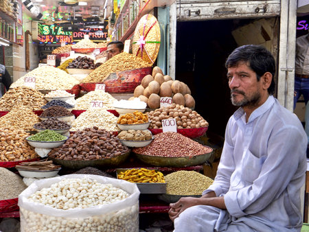 DELHI, INDIA - MARCH 14, 2019: close view of a vendor selling nuts at the spice market in old delhi