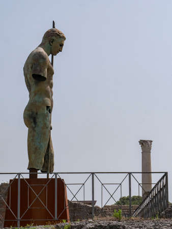 NAPLES, ITALY- JUNE, 13, 2019: modern art bronze statue of a soldier with a spear by igor mitoraj at pompeii ruinsのeditorial素材