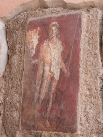 NAPLES, ITALY- JUNE, 13, 2019: fresco painting of a man holding a horse, by its bridle, on a house wall at pompeiiのeditorial素材