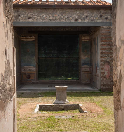 NAPLES, ITALY- JUNE, 13, 2019: the ruins of a house and courtyard in the ancient roman city of pompeiiのeditorial素材