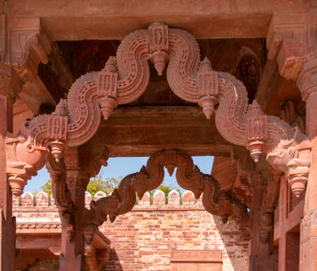 FATEPHUR SIKRI, INDIA- MARCH, 27, 2019: close up of an ornately carved doorway at fatephur sikri palace complexのeditorial素材