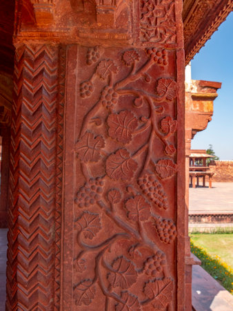 FATEPHUR SIKRI, INDIA- MARCH, 27, 2019: a grapevine design on the column of an ancient mughal palaceのeditorial素材