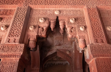 AGRA, INDIA - MARCH, 28, 2019: a decorative doorway arch at red fort