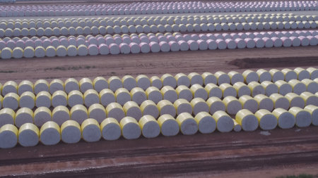aerial view of rows of cotton bales to be processed by a cotton gin