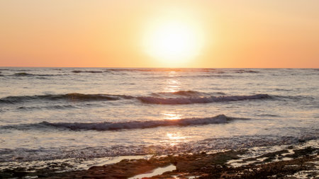 the sun setting from playa sirena beach at corcovado