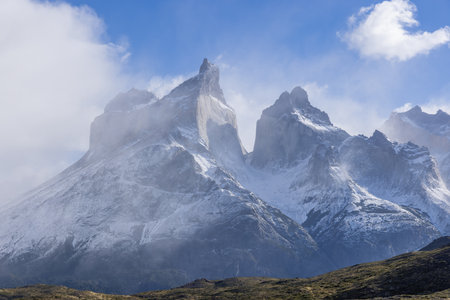 a close up of a sunlit cuernos principal on a stormy autumn day at torres del paine national park in patagonia, chileの写真素材