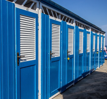 Blue and white beach cabinsの写真素材