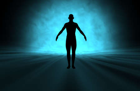Male figure with bright blue light shining from behindの写真素材