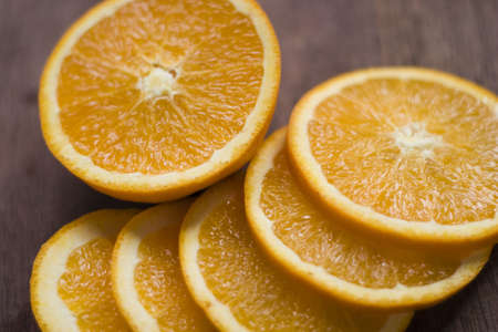 Sliced orange on a wooden surfaceの写真素材