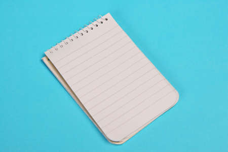 Small pad isolated on a blue surfaceの写真素材