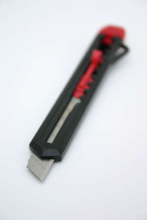 Black and red stanley knife on a white backgroundの写真素材