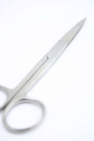 Pair of silver scissors on a white backgroundの写真素材