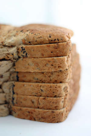 Sliced bread stacked on a light backgroundの写真素材