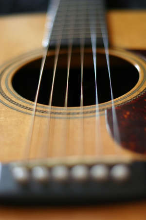 Acoustic guitar closeup looking down stringsの写真素材