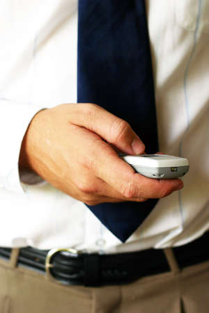 Businessman holding a mobile phoneの写真素材