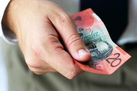 Hand holding australian bank notesの写真素材