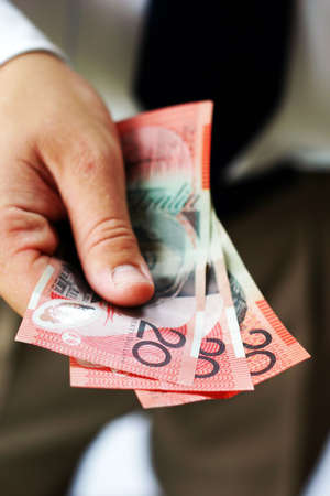 Hand holding australian bank notesの写真素材