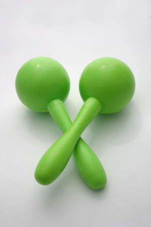 Green maracas on a light backgroundの写真素材