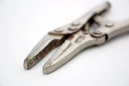 Pair of pliers on a light surfaceの写真素材