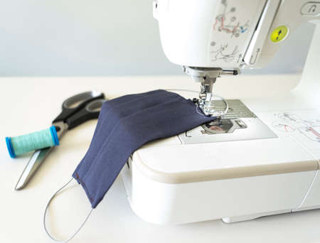 Sewing machine making safety washable face mask during pandemic virusの写真素材