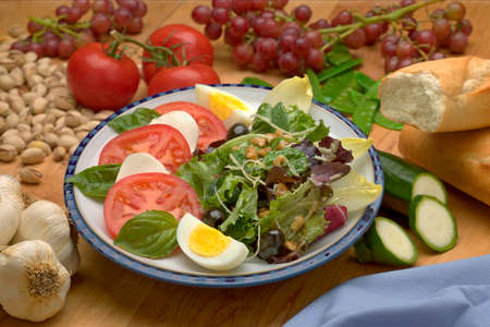 Fresh  green Salad with Tomatoes and Mozzarellaの写真素材