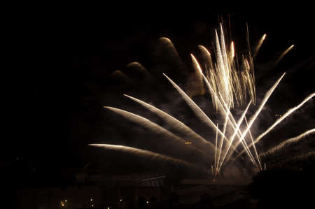 Trials of light being left by several fireworksの写真素材