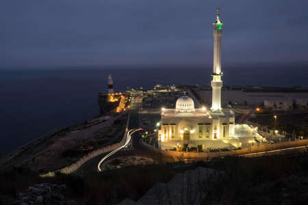 Night photography capturing the lighthouse and the mosqueの写真素材