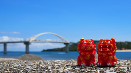Okinawa's ocean and Shisa, Motobu Town, Okinawa Prefecture, Sesoko Bridgeの写真素材