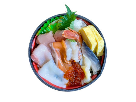 A bowl of rice topped with colorful seafoodの写真素材