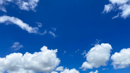 Clear blue sky and white clouds in the Okinawa skyの写真素材