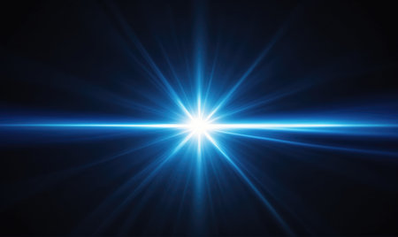 A bright blue light shines in the dark, creating a starburst effectの素材
