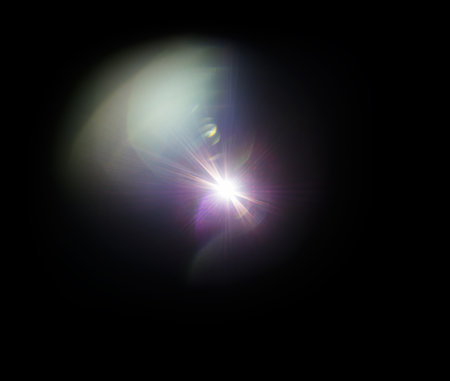 Colorful lens flare effect. Solar flare with rays and spotlights backgroundの写真素材