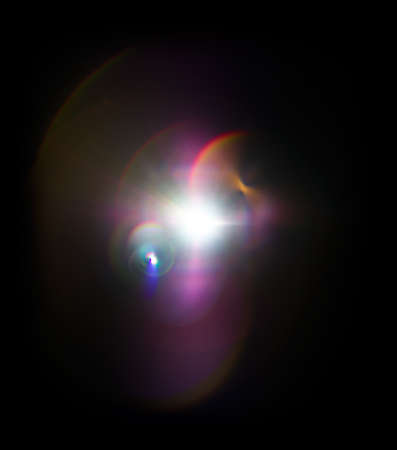 Colorful lens flare effect. Solar flare with rays and spotlights backgroundの写真素材
