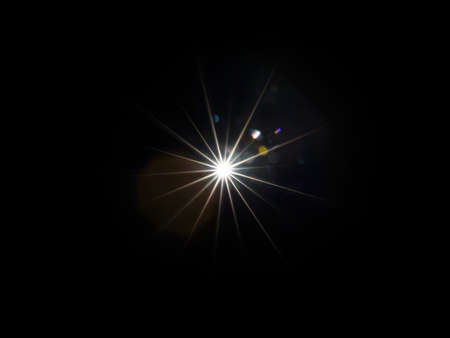 Colorful lens flare effect. Solar flare with rays and spotlights backgroundの写真素材