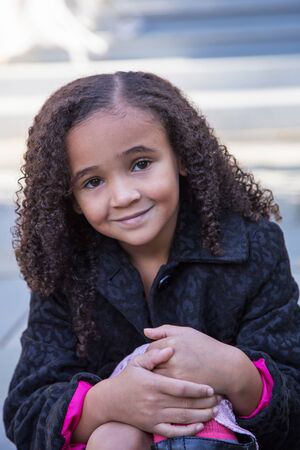 Little girl looking at cameraの写真素材