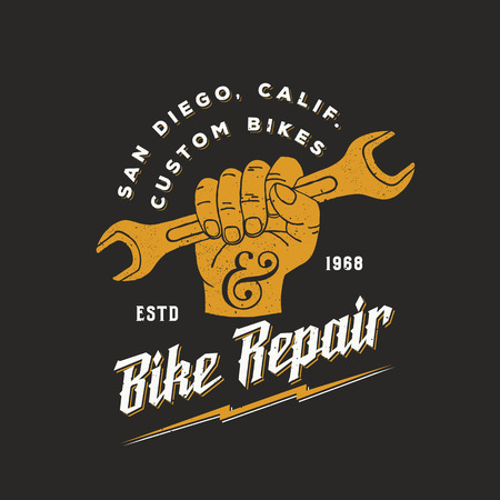 Bike Repair Abstract Vintage Sign, Label or Template. Fist Holding Wrench with Retro Typography and Shabby Textures. On Dark Background.のイラスト素材