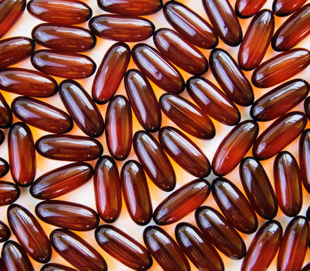 Many Flax Seed Oil Gel Caps on Whiteの写真素材