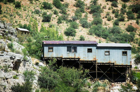 Corrugated metal miner's shack perched on an Arizona hillside.の写真素材