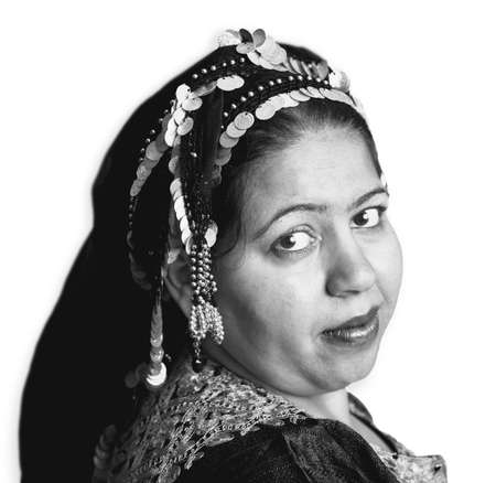 Portrait of a Muslim Woman in an Ornate Head Scarfの写真素材