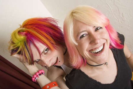 Two hip girls with brightly coloroed hairの写真素材
