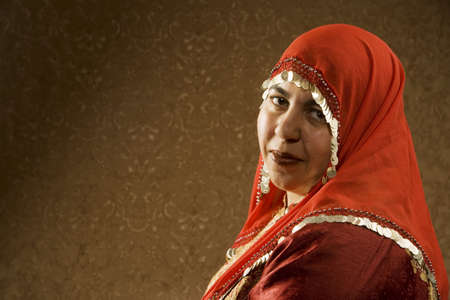 Portrait of a Muslim Woman in a Red Head Scarfの写真素材