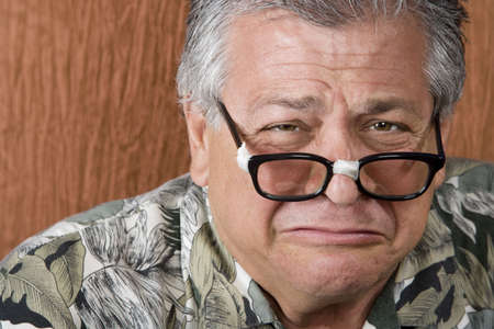 Silly Mexican-Italian Man with Taped Corrective Glassesの写真素材