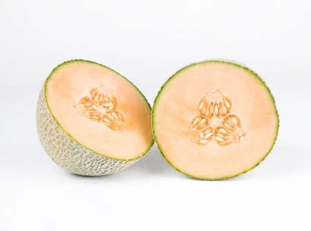 Halved cantelope isolated on a white background