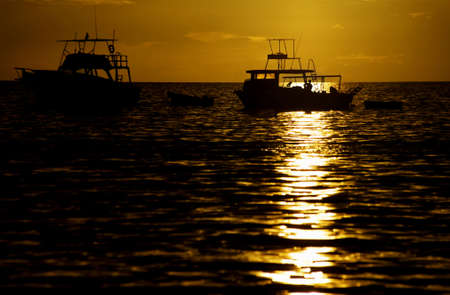 Costa Rica sunset with Boats in the Pacific Oceanの写真素材