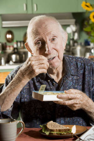 Portrait of Elder Man Discussing Medications